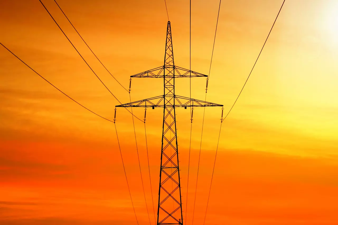Electrical power transmission with tower at sunset