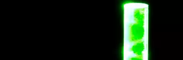 Flame bar and light pipe of MS materials optically coupled by contact showing green laser light reflections through coupled area.