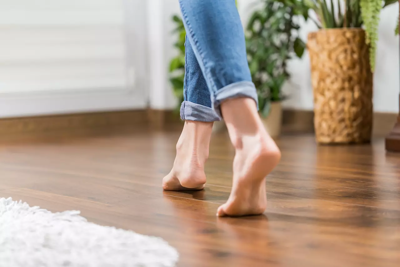 A lady's feet on wooden flooring