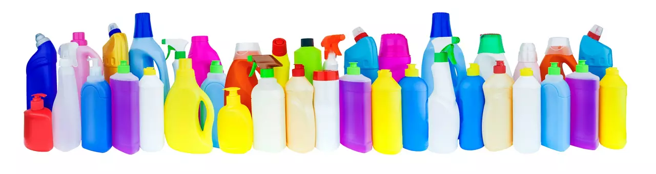 Multicolored bottles with household chemicals.