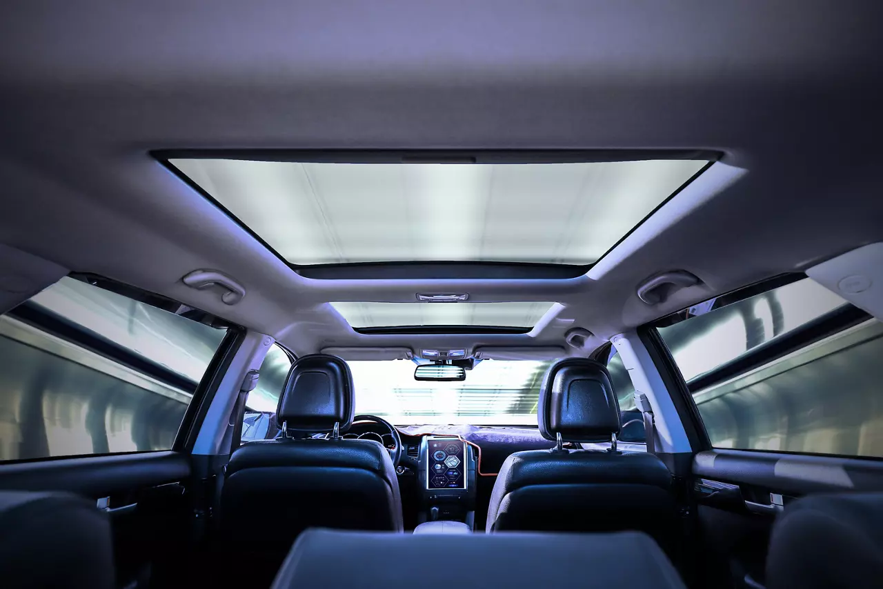 Interior shot of an automobile from the backseat