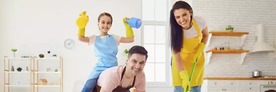 Happy family cleans the room in the house
