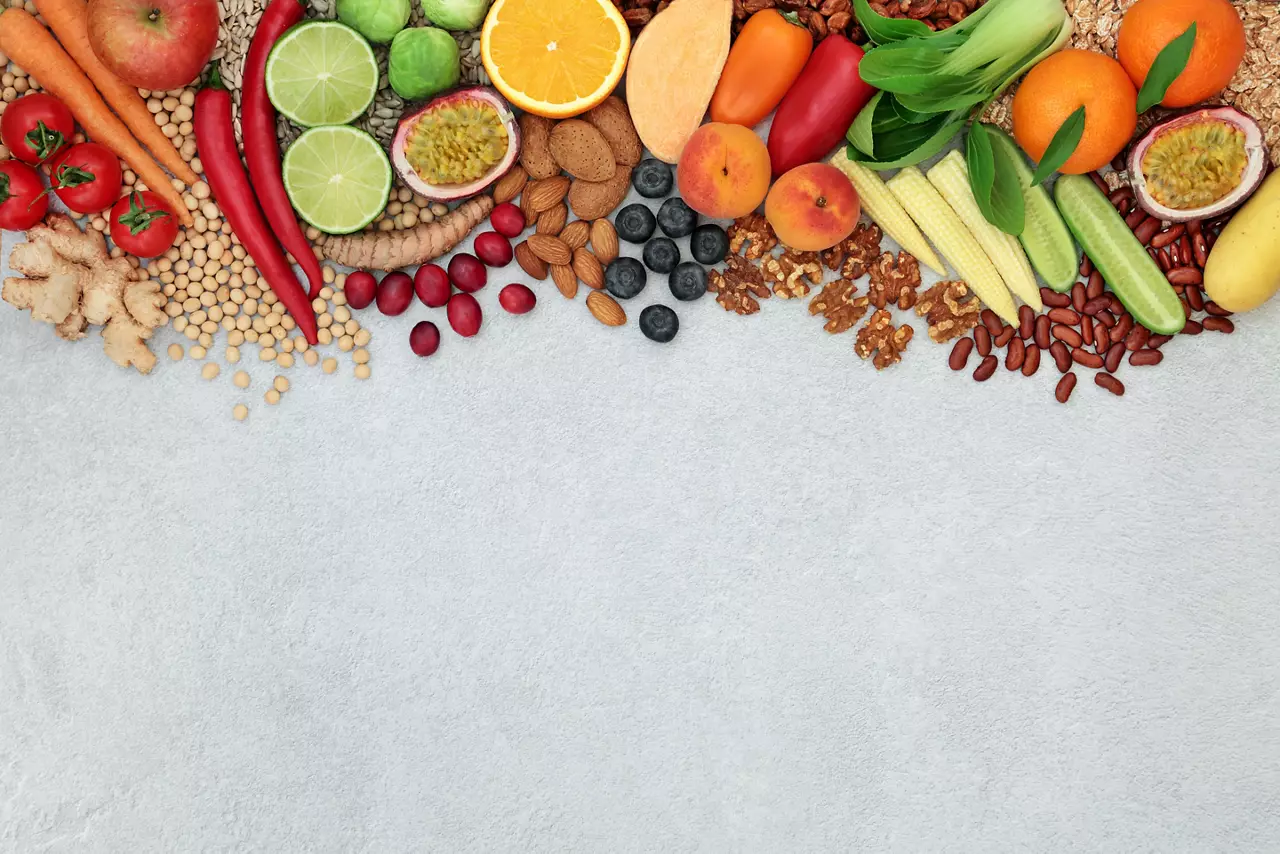 Vegan health food background border with a large collection of foods
