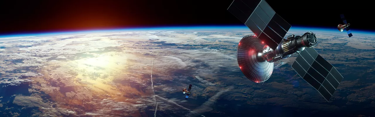 Space satellite with antenna and solar panels in space against the background of the earth. Telecommunications, high-speed Internet, space exploration. mixed medium, copy space. image furnished by NASA.