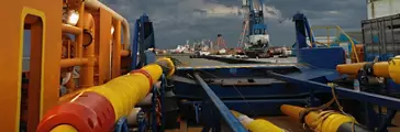 Cable-laying vessel lays cable at sea