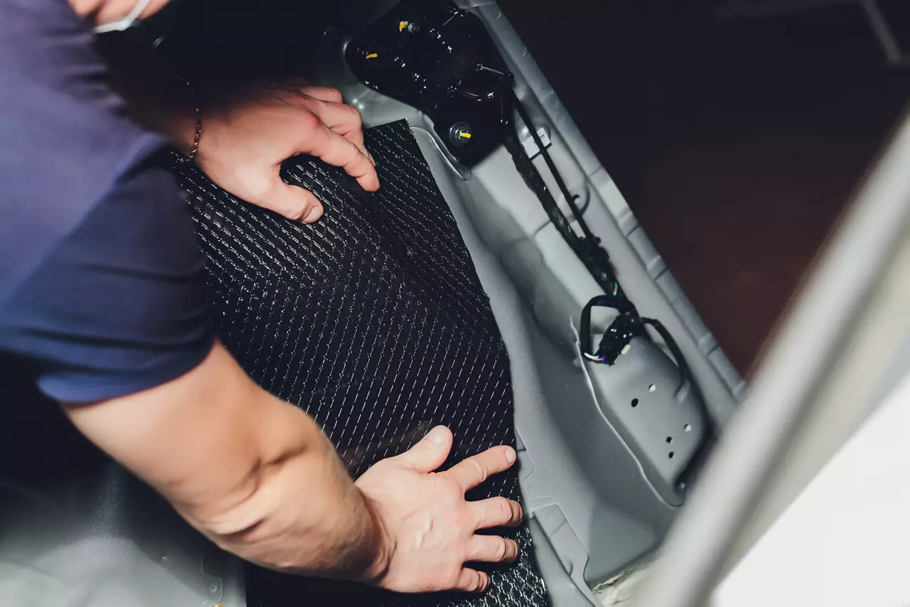 Installation of sound insulation material on the car.