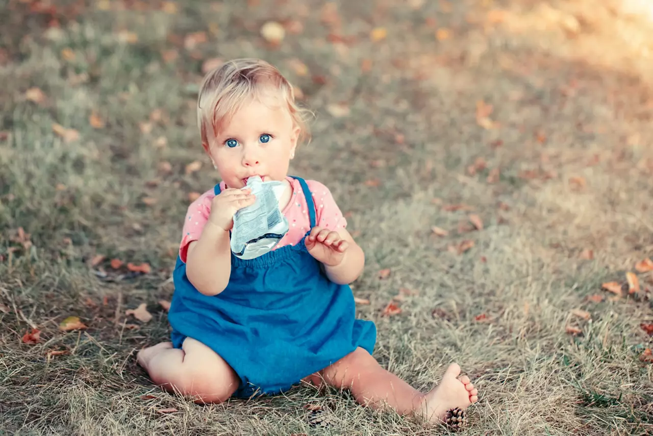 Baby drinking from a stand-up pouch  