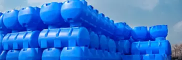 Blue stacked plastic barrels