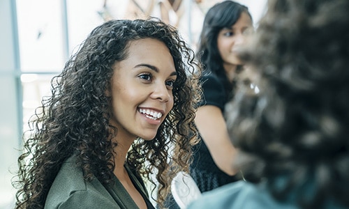 Smiling woman with curly hair