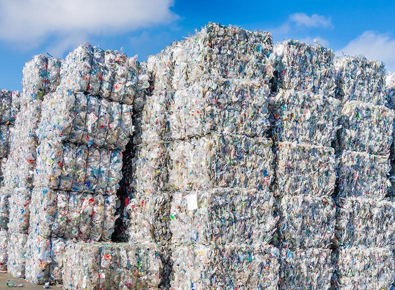 Plastics recycling centers and raw material