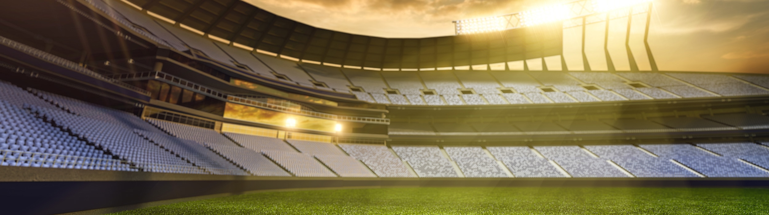 Rendering of an empty stadium with lights on