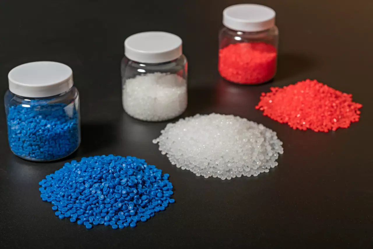 Close-up of plastic polymer granules. hand hold Polymer pellets. polymer plastic. compound polymer.